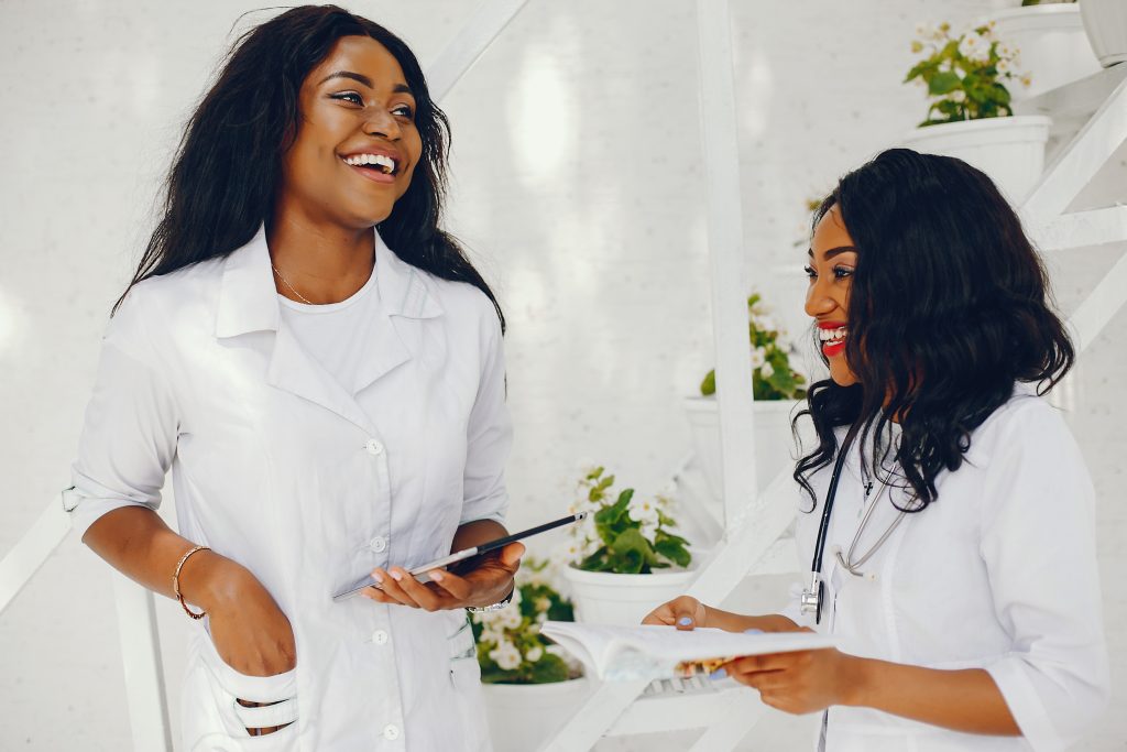Smiling Black woman doctor wearing a stethoscope