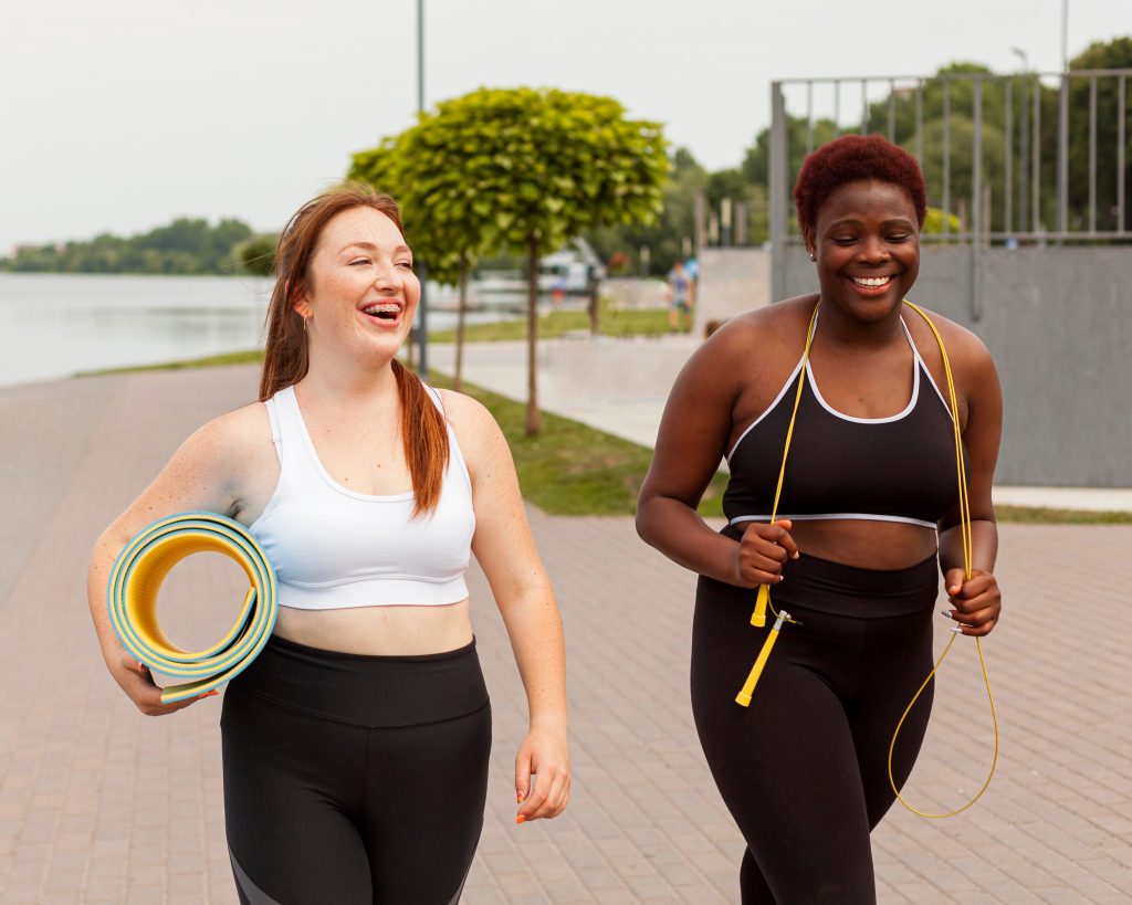 Two women jogging together outdoors