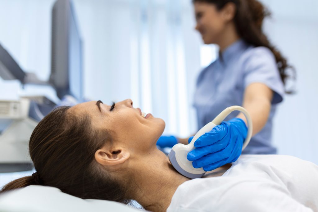 Doctor examining a patient's throat