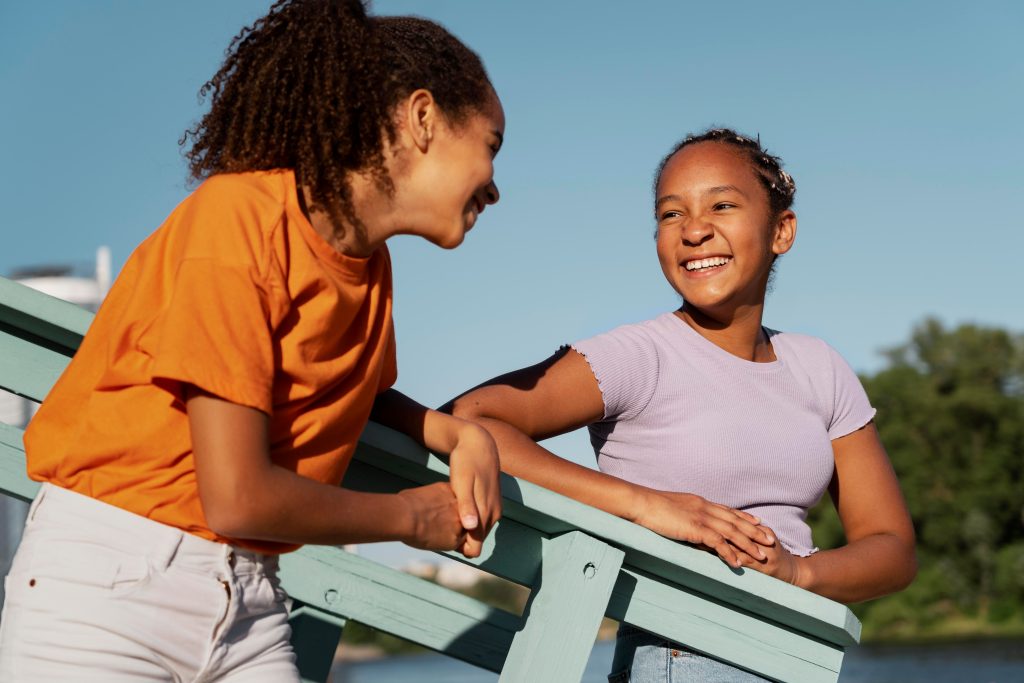 Father and daughter high-fiving outdoors