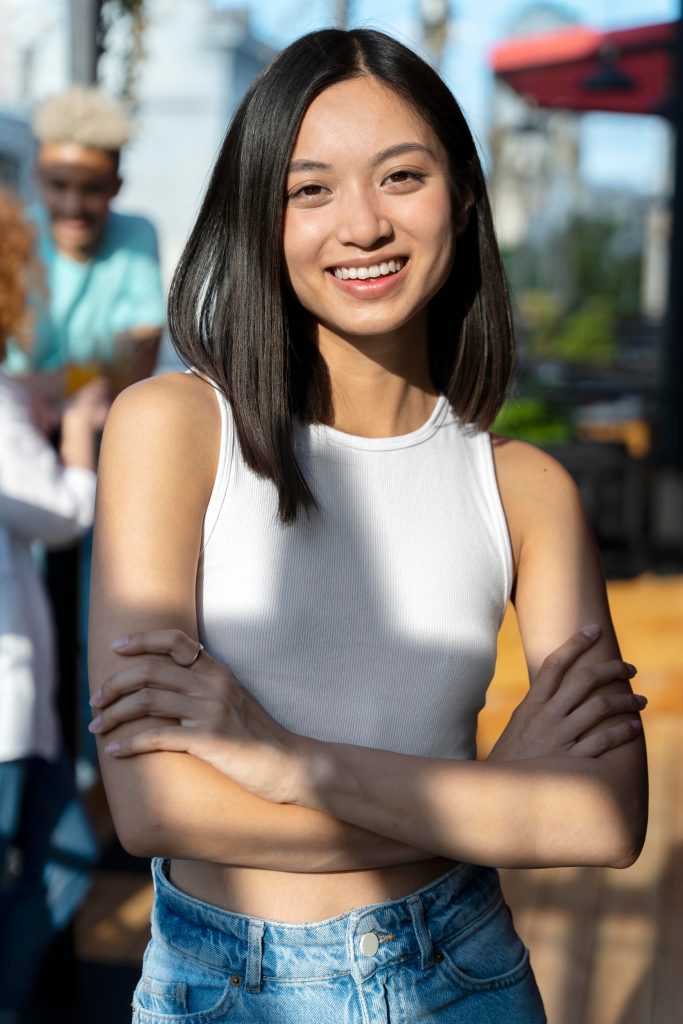 Smiling businesswoman with arms crossed