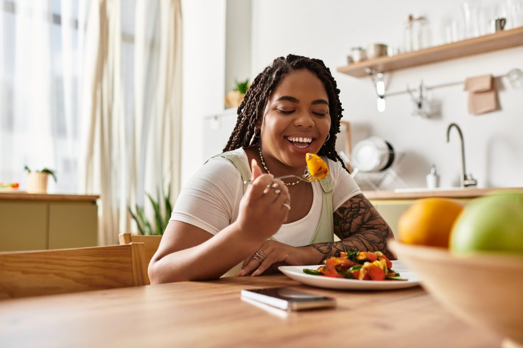 Smiling woman enjoying a healthy meal at home