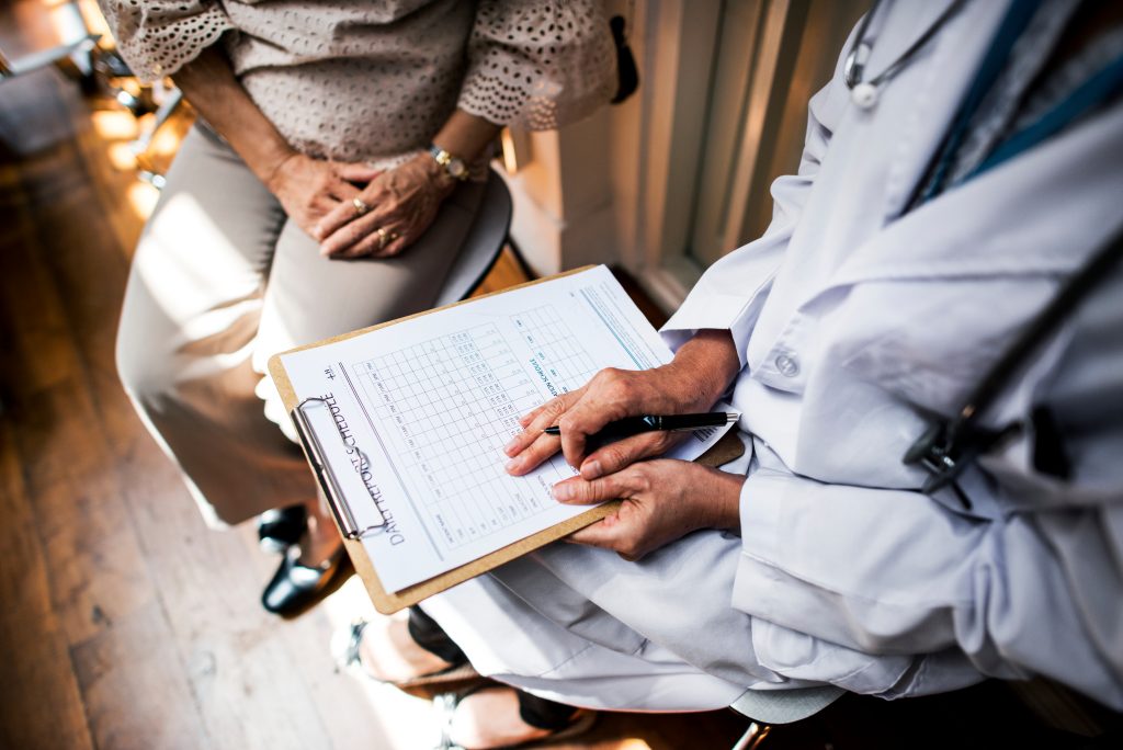 Doctor reviewing medical paperwork