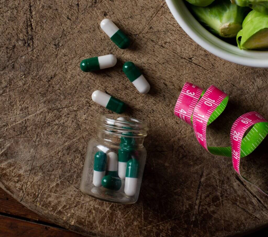 Supplements and medication bottles on a table