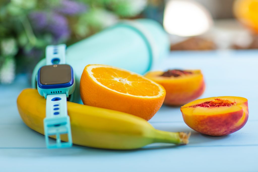 Fresh fruit and a syringe representing diabetes management