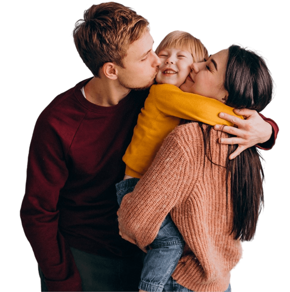 Father kissing his daughter on the cheek while holding her