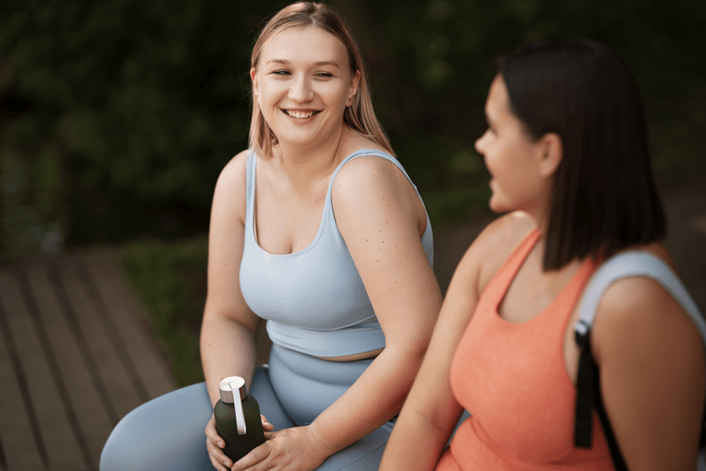 Side view of women chatting outdoors